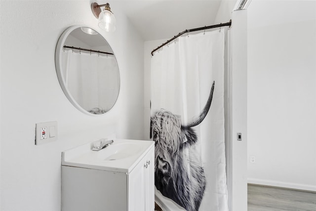 3501 Alta Vista Dr, Waco, TX 76706 - full bath featuring vanity and wood finished floors