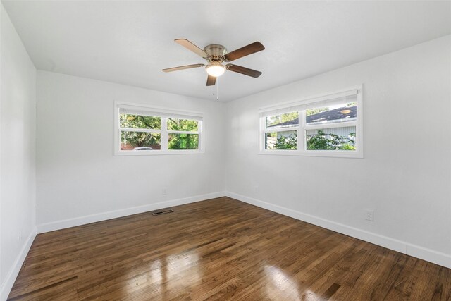 3501 Alta Vista Dr, Waco, TX 76706 - empty room with plenty of natural light, dark wood-style flooring, and ceiling fan