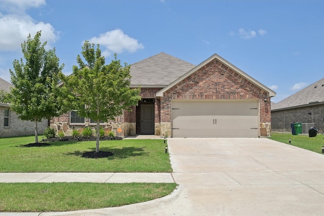 288 Thoroughbred St, Waxahachie, TX 75165 - view of front of property featuring brick siding, a garage, a front lawn, and driveway