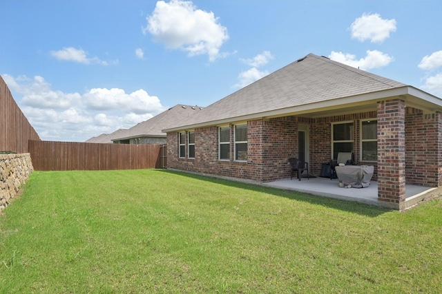 288 Thoroughbred St, Waxahachie, TX 75165 - back of property with a patio, a fenced backyard, and brick siding