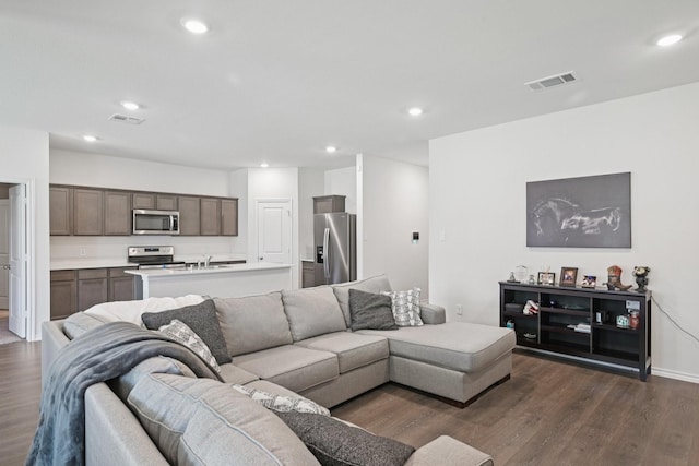 288 Thoroughbred St, Waxahachie, TX 75165 - living area featuring dark wood finished floors and recessed lighting