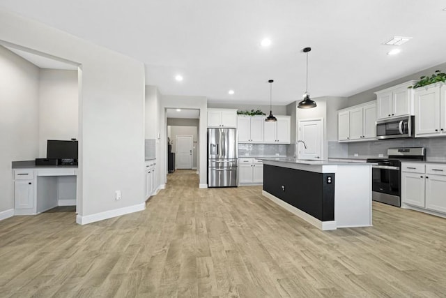 1160 Kirkham Way, Fort Worth, TX 76247 - kitchen featuring appliances with stainless steel finishes, backsplash, light wood-style floors, white cabinetry, and recessed lighting