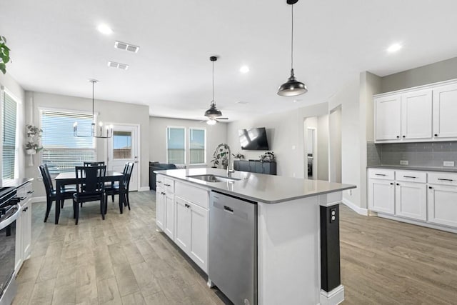 1160 Kirkham Way, Fort Worth, TX 76247 - kitchen featuring appliances with stainless steel finishes, light wood-type flooring, white cabinetry, and recessed lighting