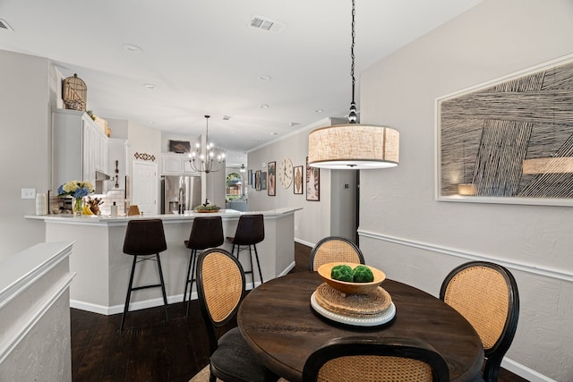 416 Springhill Dr, Hurst, TX 76054 - dining area with a chandelier, dark wood-type flooring, and recessed lighting