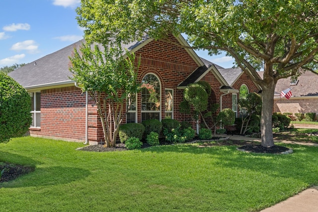 416 Springhill Dr, Hurst, TX 76054 - view of front of property featuring brick siding, a front lawn, and roof with shingles