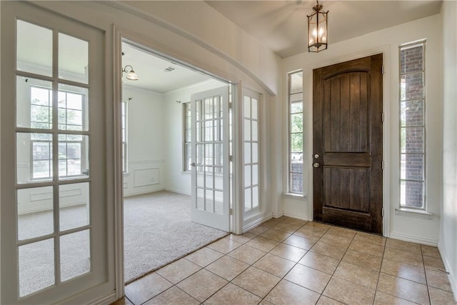 1300 Meadow Ranch Rd, Mckinney, TX 75071 - foyer entrance with plenty of natural light, light tile patterned flooring, and light colored carpet