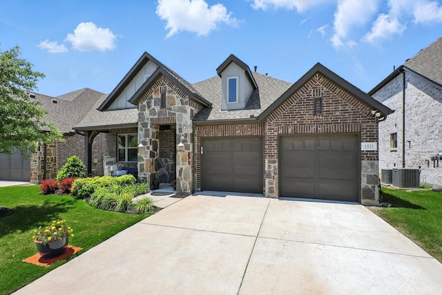 1521 Twistleaf Rd, Flower Mound, TX 76226 - view of front of property with concrete driveway, a front yard, brick siding, a garage, and roof with shingles