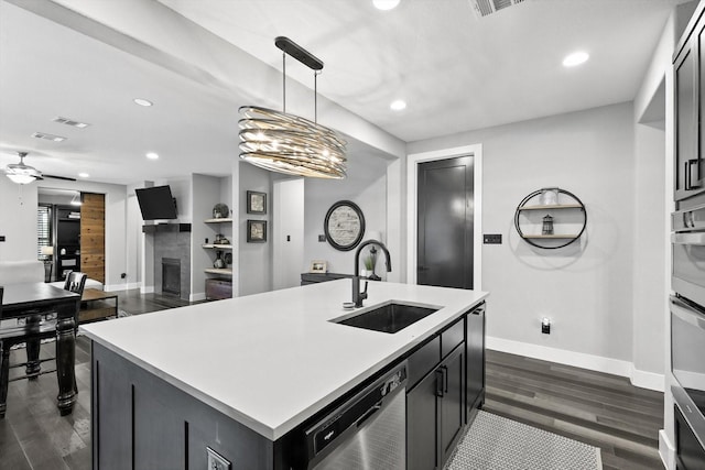 1521 Twistleaf Rd, Flower Mound, TX 76226 - kitchen featuring dishwasher, recessed lighting, dark wood-style floors, a fireplace, and light countertops