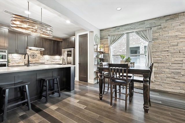 1521 Twistleaf Rd, Flower Mound, TX 76226 - dining area with dark wood-style flooring and recessed lighting