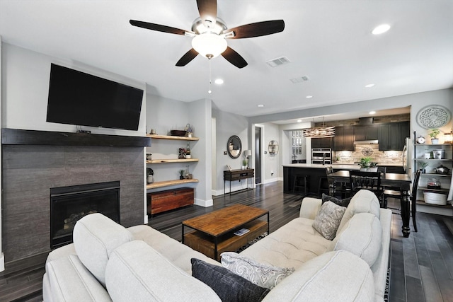1521 Twistleaf Rd, Flower Mound, TX 76226 - living area with dark wood-type flooring, ceiling fan, recessed lighting, and a fireplace