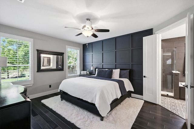 1521 Twistleaf Rd, Flower Mound, TX 76226 - bedroom featuring a decorative wall, dark wood-style floors, a ceiling fan, and connected bathroom