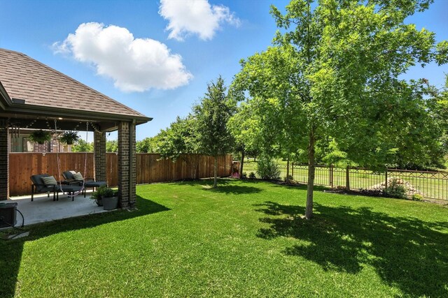 1521 Twistleaf Rd, Flower Mound, TX 76226 - fenced backyard with a patio area