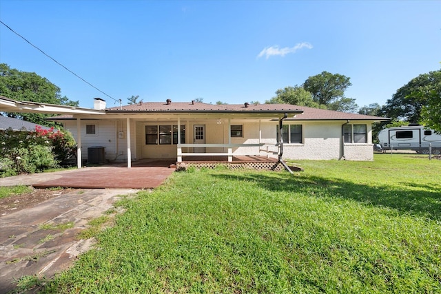 1205 Columbia Cir, Corsicana, TX 75110 - back of property with a lawn and a patio area