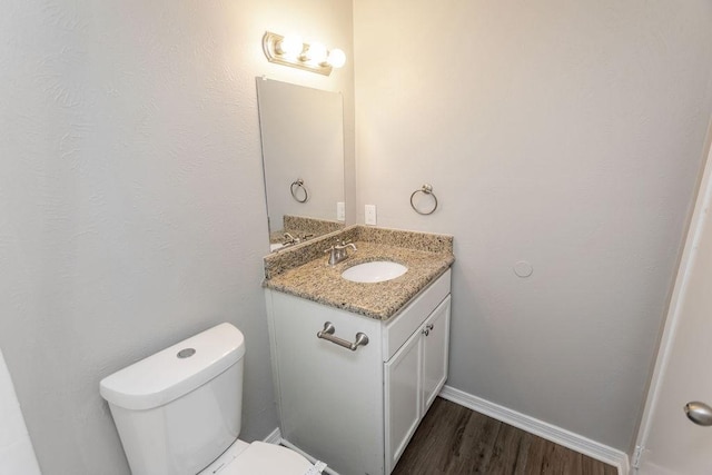 4229 Shagbark St, Fort Worth, TX 76137 - half bathroom with vanity and wood finished floors