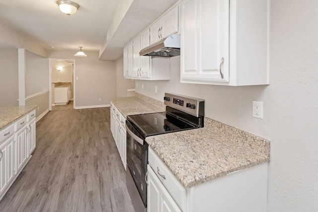 4229 Shagbark St, Fort Worth, TX 76137 - kitchen with electric range, under cabinet range hood, white cabinetry, light wood-style flooring, and light stone countertops