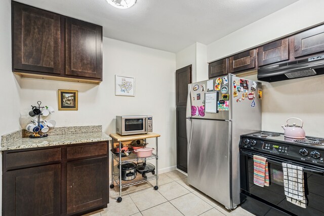 7640 W Greenway Blvd Unit 3D, Dallas, TX 75209 - kitchen featuring stainless steel appliances, dark brown cabinetry, exhaust hood, and light tile patterned floors