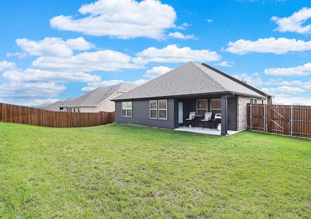 505 Reatta Dr, Justin, TX 76247 - rear view of property with a fenced backyard, a patio, and roof with shingles