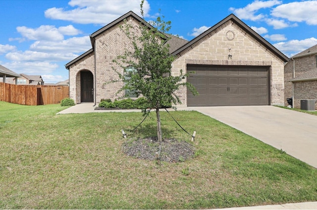 505 Reatta Dr, Justin, TX 76247 - french country home with brick siding, a garage, and driveway
