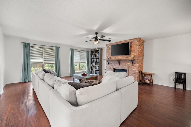 4412 Corner Brook Ln, Fort Worth, TX 76123 - living area featuring ceiling fan, wood finished floors, a brick fireplace, and a textured ceiling