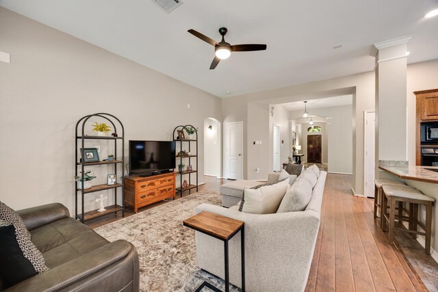 2823 Coteau Way, Dallas, TX 75227 - living area featuring ceiling fan, hardwood / wood-style floors, and arched walkways