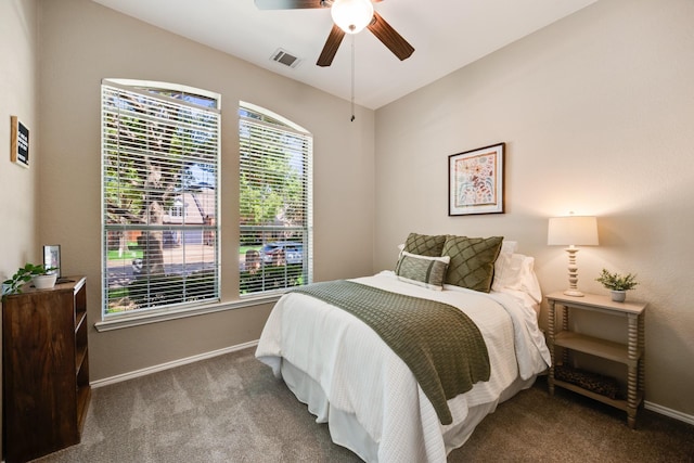 2823 Coteau Way, Dallas, TX 75227 - carpeted bedroom with baseboards and a ceiling fan