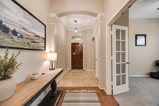 2823 Coteau Way, Dallas, TX 75227 - entrance foyer with arched walkways, ornamental molding, and wood finished floors