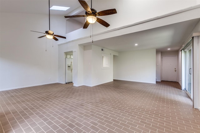 7450 Holly Hill Dr Unit 115, Dallas, TX 75231 - unfurnished living room featuring brick patterned flooring, ceiling fan, recessed lighting, and high vaulted ceiling