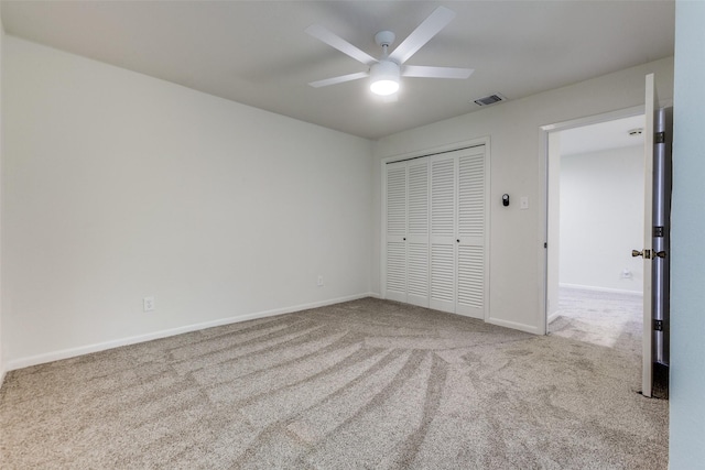 7450 Holly Hill Dr Unit 115, Dallas, TX 75231 - unfurnished bedroom with carpet floors, a closet, and ceiling fan