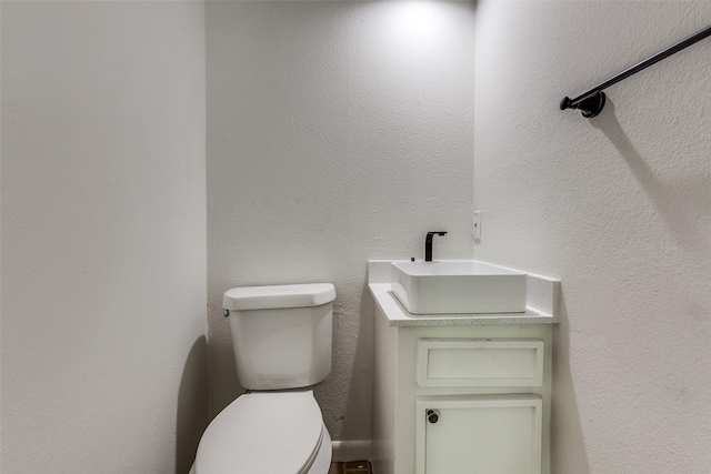 7450 Holly Hill Dr Unit 115, Dallas, TX 75231 - bathroom featuring a sink and toilet