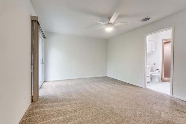 7450 Holly Hill Dr Unit 115, Dallas, TX 75231 - spare room featuring a ceiling fan and light carpet