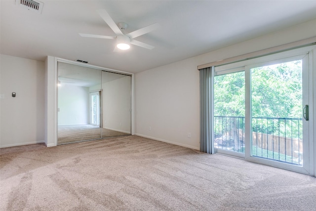 7450 Holly Hill Dr Unit 115, Dallas, TX 75231 - unfurnished room with carpet flooring and ceiling fan