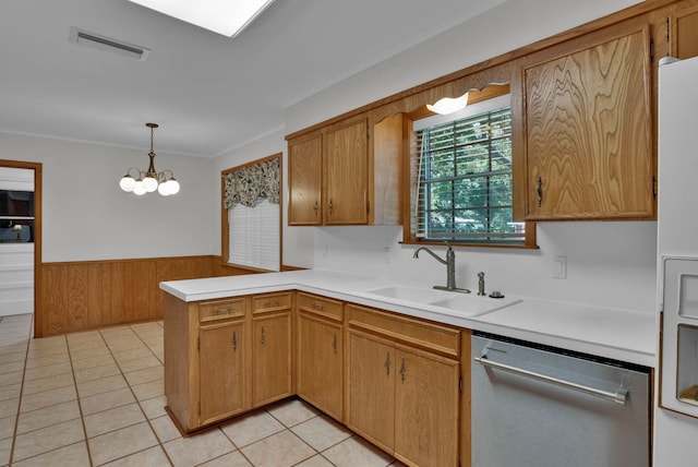 824 Captain Shreve Dr, Shreveport, LA 71105 - kitchen featuring dishwasher, light countertops, a wainscoted wall, a peninsula, and light tile patterned floors