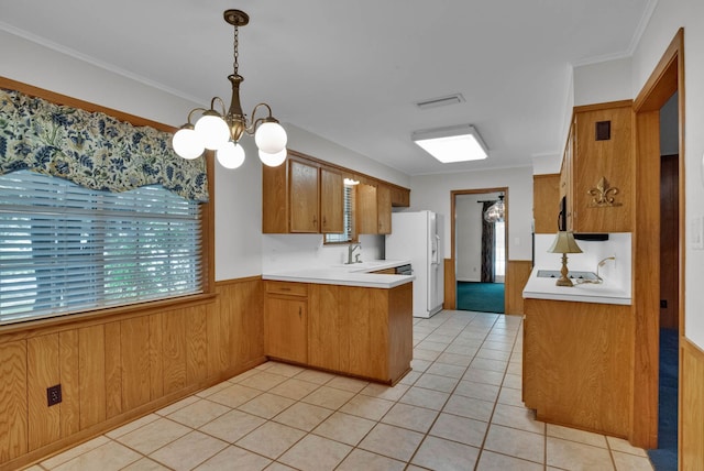 824 Captain Shreve Dr, Shreveport, LA 71105 - kitchen featuring a chandelier, white refrigerator with ice dispenser, light countertops, light tile patterned floors, and brown cabinets