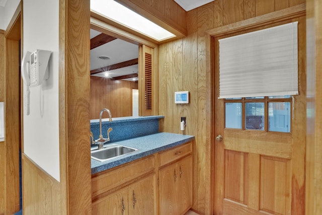 824 Captain Shreve Dr, Shreveport, LA 71105 - kitchen featuring dark countertops, beamed ceiling, and wood walls