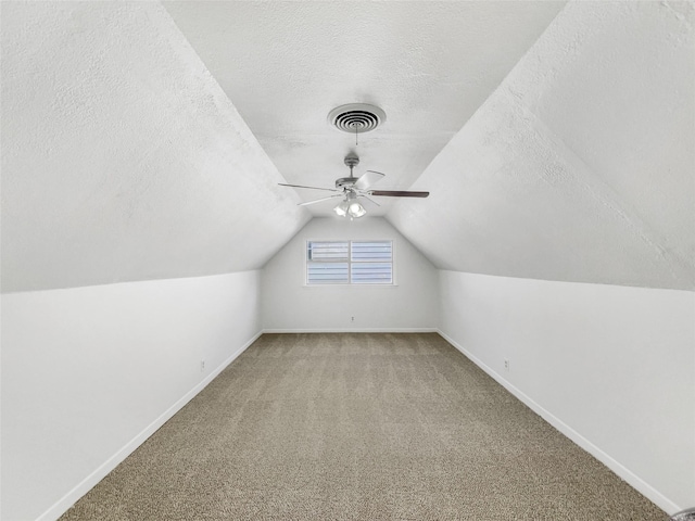 5941 Ten Mile Bridge Rd, Fort Worth, TX 76135 - additional living space featuring a textured ceiling, ceiling fan, vaulted ceiling, and carpet floors