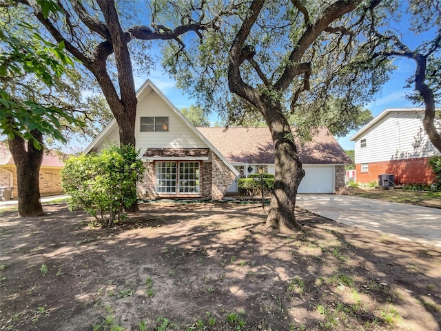 5941 Ten Mile Bridge Rd, Fort Worth, TX 76135 - view of front of house featuring brick siding, concrete driveway, and a garage