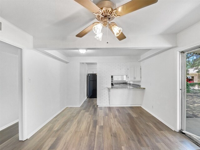 5941 Ten Mile Bridge Rd, Fort Worth, TX 76135 - unfurnished living room with a ceiling fan and dark wood-type flooring