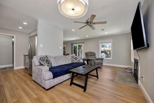 5125 Susan Lee Ln, North Richland Hills, TX 76180 - living area featuring a ceiling fan, light wood-style floors, a fireplace with flush hearth, and recessed lighting