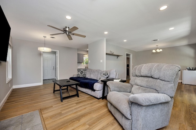 5125 Susan Lee Ln, North Richland Hills, TX 76180 - living area with light wood finished floors, a ceiling fan, recessed lighting, and a chandelier