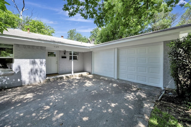 5125 Susan Lee Ln, North Richland Hills, TX 76180 - view of front of property with brick siding, concrete driveway, and an attached garage