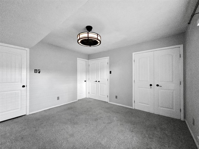 6620 Eastridge Dr Unit 219, Dallas, TX 75231 - unfurnished bedroom with carpet and multiple closets
