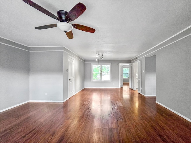 6620 Eastridge Dr Unit 219, Dallas, TX 75231 - unfurnished living room with wood finished floors, a ceiling fan, crown molding, and a textured ceiling