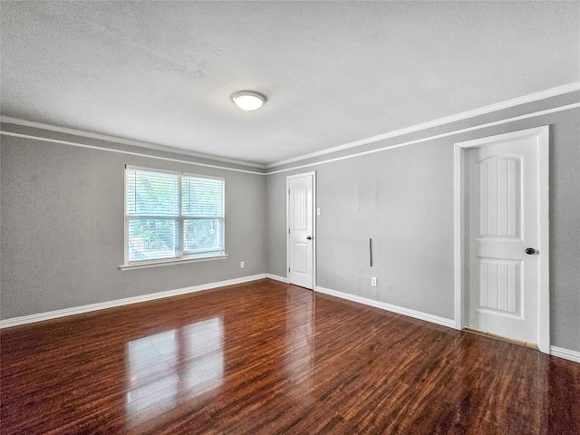 6620 Eastridge Dr Unit 219, Dallas, TX 75231 - empty room with wood finished floors, ornamental molding, and a textured ceiling