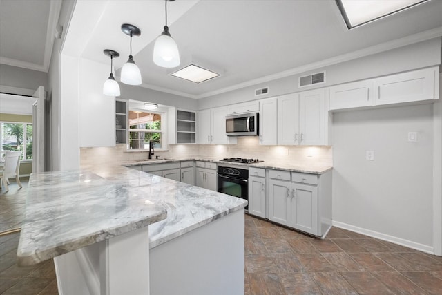 1215 Columbia Cir, Corsicana, TX 75110 - kitchen featuring a peninsula, stainless steel microwave, oven, open shelves, and gas stovetop
