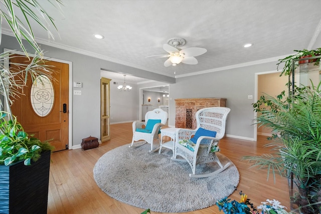 1215 Columbia Cir, Corsicana, TX 75110 - living area featuring a chandelier, ceiling fan, wood finished floors, and recessed lighting