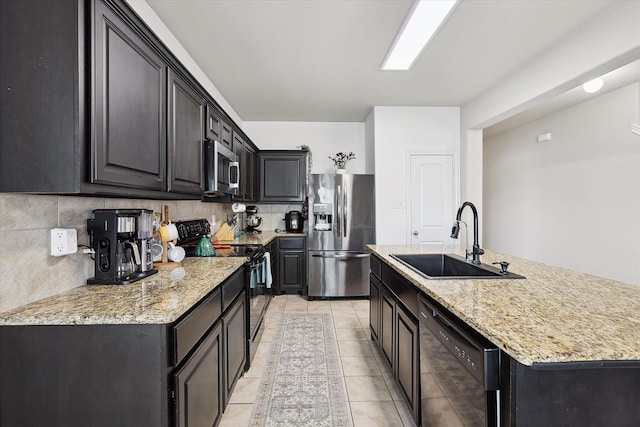 616 Cameron Way, Azle, TX 76020 - kitchen with black appliances, backsplash, light tile patterned flooring, an island with sink, and light stone countertops