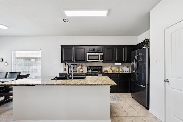 616 Cameron Way, Azle, TX 76020 - kitchen featuring stainless steel microwave, fridge with ice dispenser, black / electric stove, and light stone counters