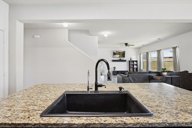 616 Cameron Way, Azle, TX 76020 - kitchen featuring light stone counters, ceiling fan, and open floor plan