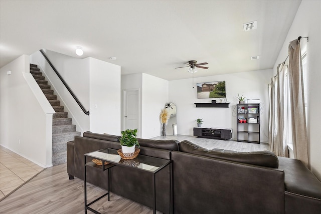 616 Cameron Way, Azle, TX 76020 - living room featuring ceiling fan, stairway, and light wood finished floors