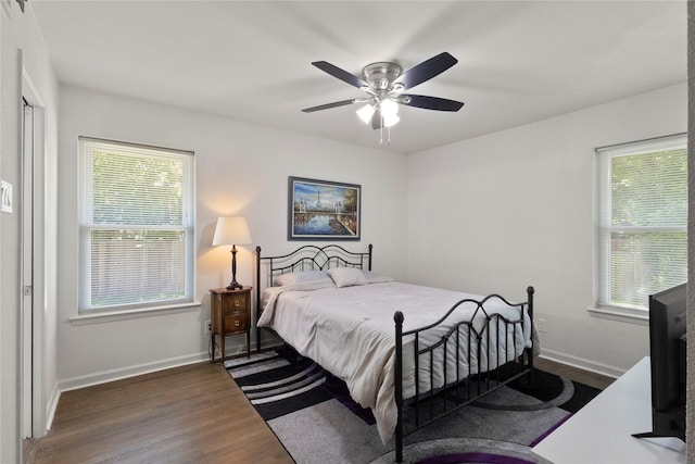 3122 Old Orchard Rd, Garland, TX 75041 - bedroom featuring wood finished floors, multiple windows, and ceiling fan